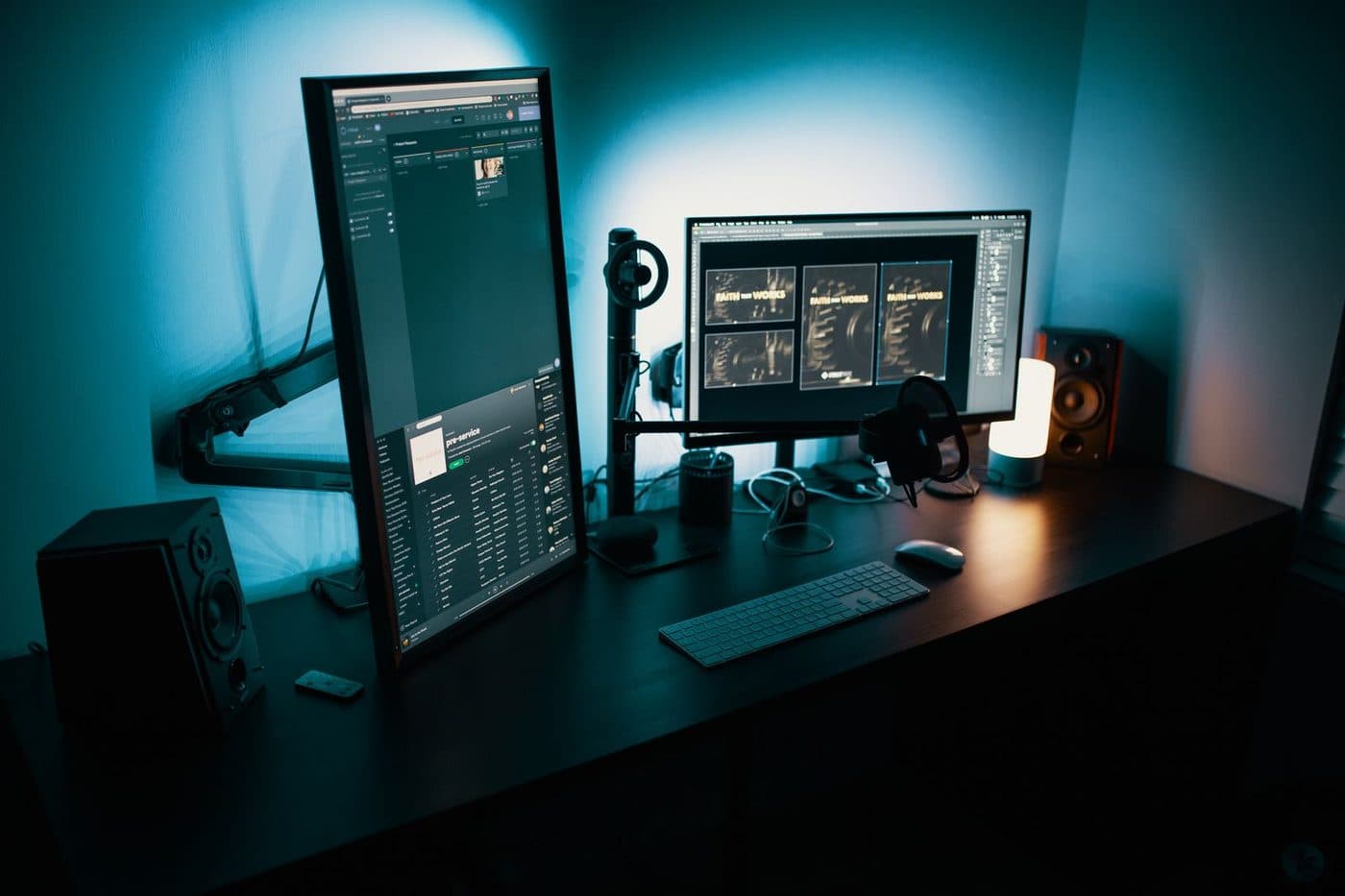 Dual computer monitors mounted on adjustable arms above a clean desk