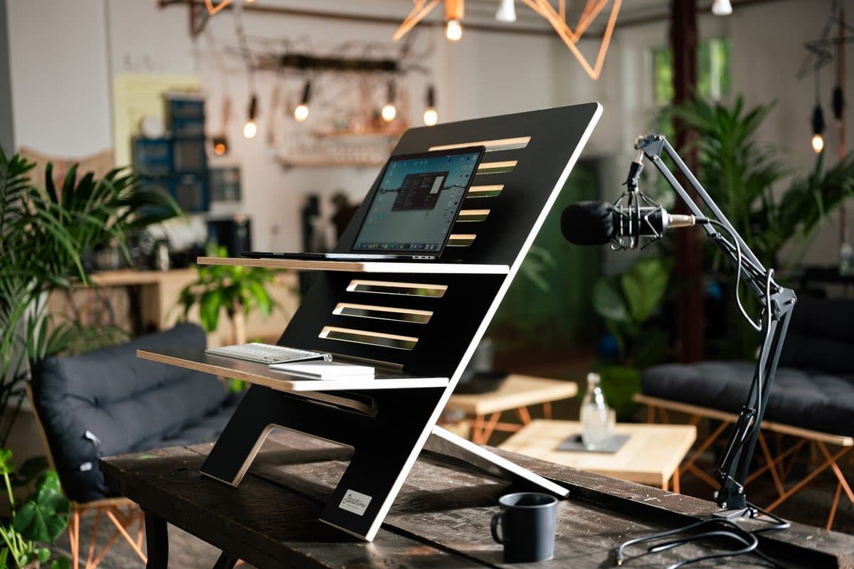 Standing desk converter with laptop at working height