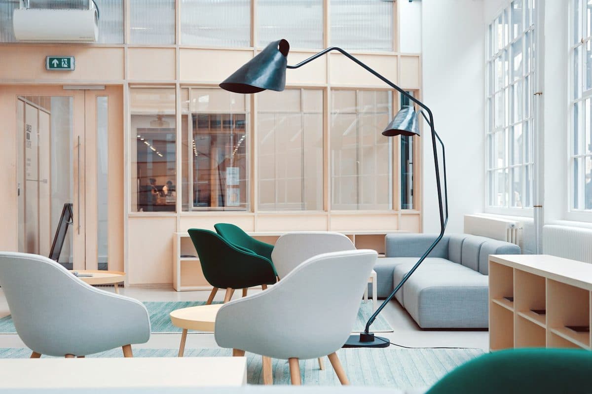 Bright workspace with desk surfaces that can support a raised screen setup