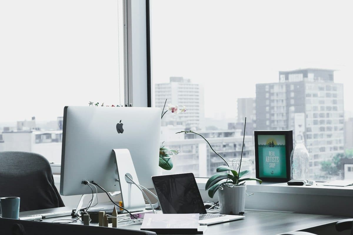 Keyboard and monitor arranged on a clean desk for upright sitting