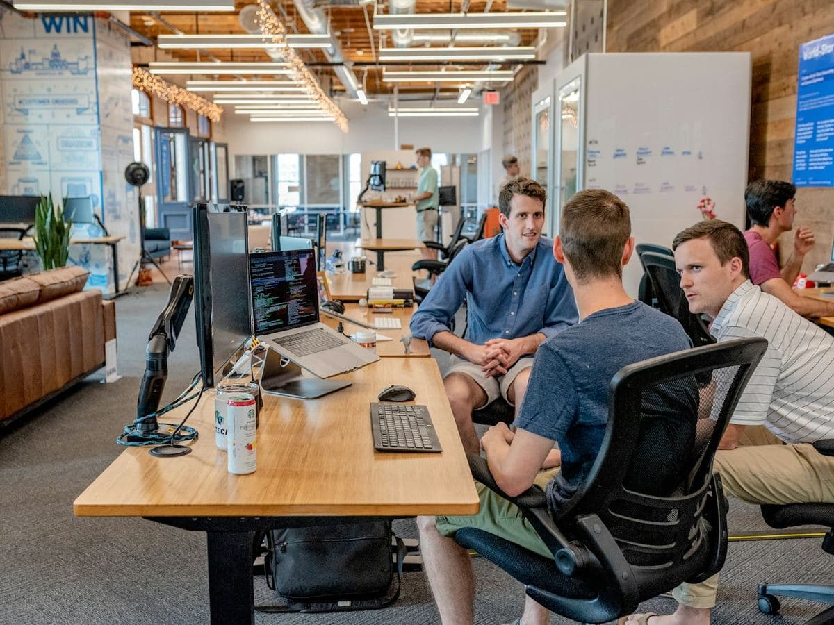 Colleagues walking through an office hallway