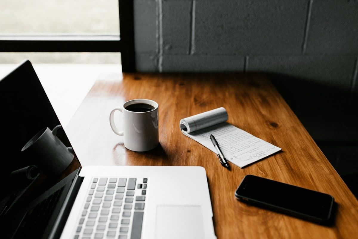 Laptop sitting flat on a desk during a long work session